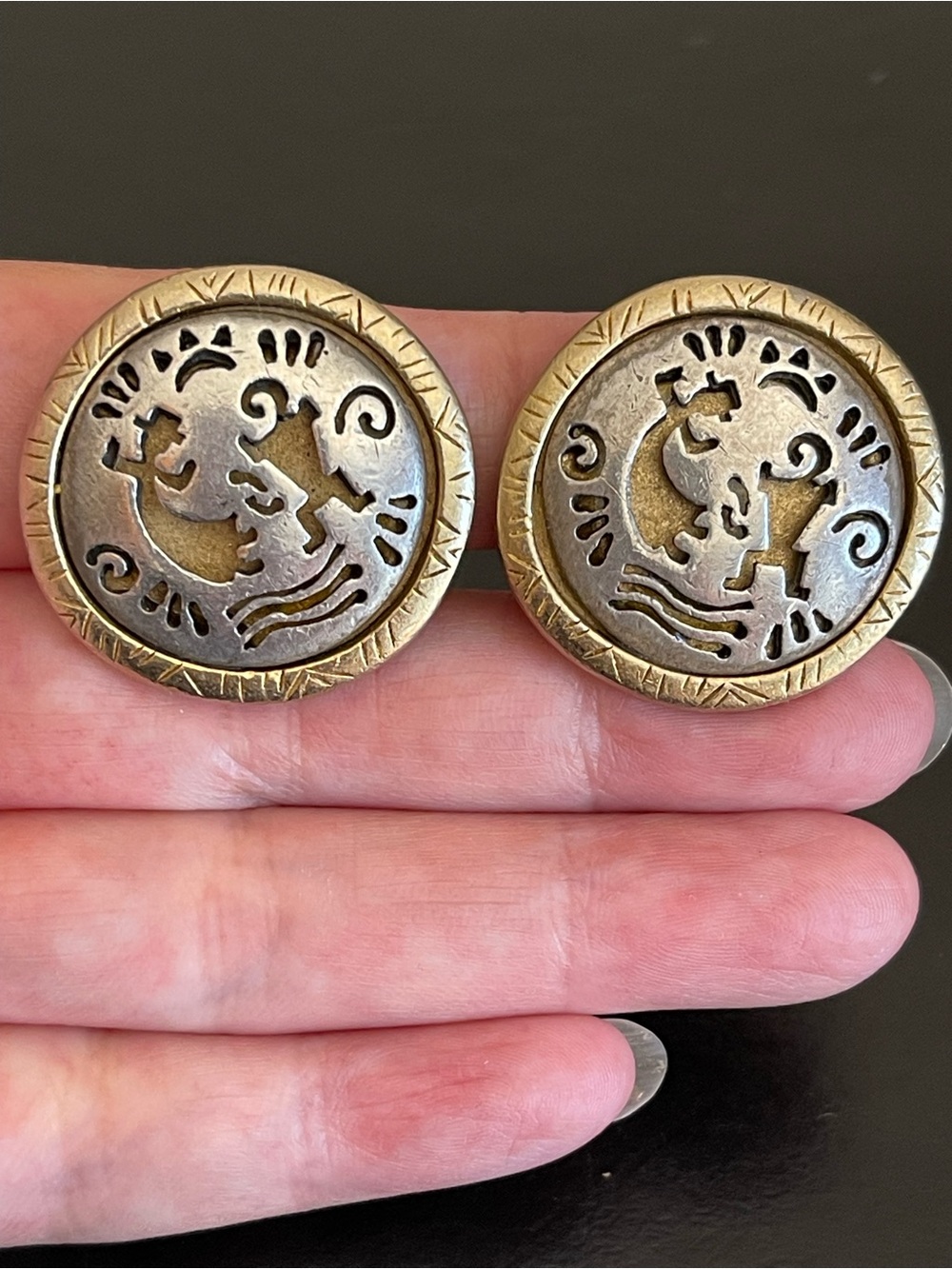 Vintage Chico’s two tone kokopelli clip on earrings.